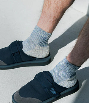 Close-up of Rototo socks styled with casual sandals, showcasing premium Japanese craftsmanship and everyday comfort.