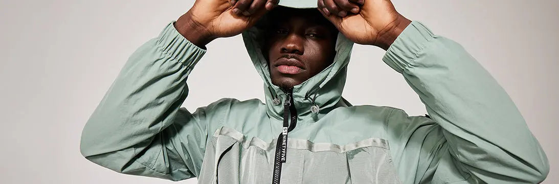 Man Wearing ST95 Mid Green Anorak With Hood Up