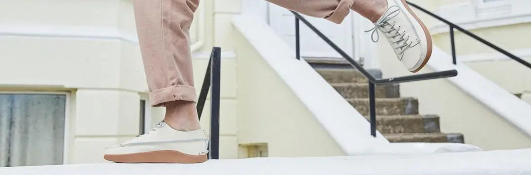 Mans Feet Walking Down Stairs Wearing Yogi Earth Shoes