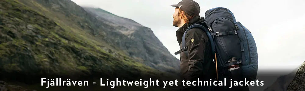 Man Hill walking Wearing a Fjallraven Lightweight Technical Jacket and Backpack